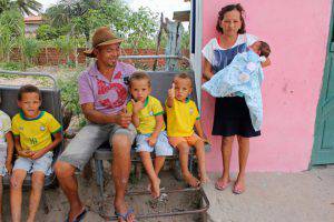 PIC BY ROBSON COELHO / CATERS NEWS - (PICTURED:Family with thirteen sons) - Meet the Brazilian couple with 13 sons, who wont stop until they have a daughter. Irineu Cruz and his wife Jusicleide Silva, who have been trying for a girl for nearly two decades, have enough sons to make up their own football team. The brood ranges from one-month to 18-years-old and the couple say they wont stop trying until a girl arrives. When Jusicleide first got pregnant, husband and wife decided mum would name the girls and Irineu would name the boys. Footie-mad dad has since christened all 13 boys after famous footballers - all beginning with the letter R. The family who live in Conceiao de Coit, in north east Brazil, hoped their thirteenth child would be a game-changer but instead the midwife announced it was yet another boy. SEE CATERS COPY